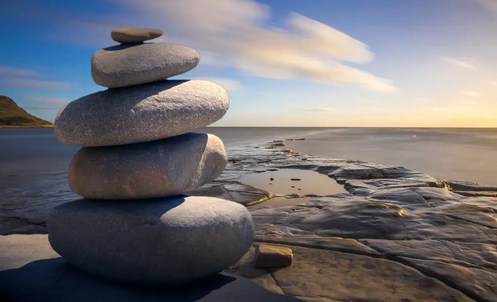 5 stacked boulders on a beach