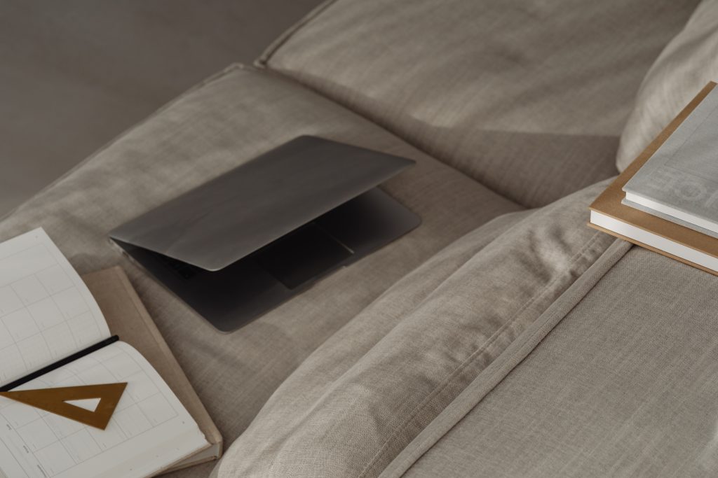 laptop half onpen on laptop beside brown ruler