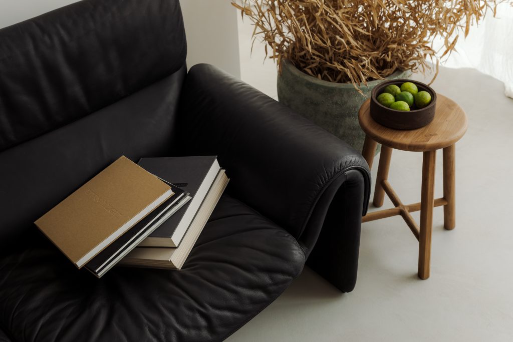 blath leather sofa with wooden stool