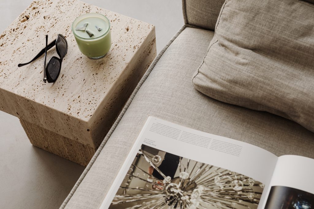 travertine coffee table with matcha latte and sunglasses