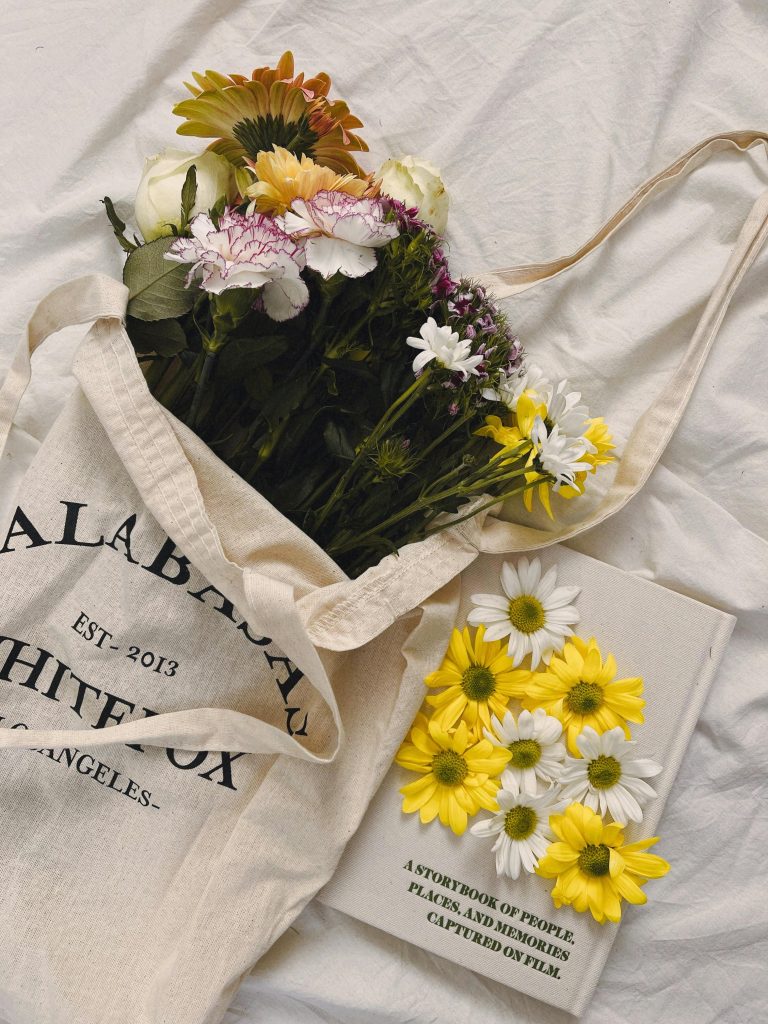 vintage tote bad with flowers and artistic book