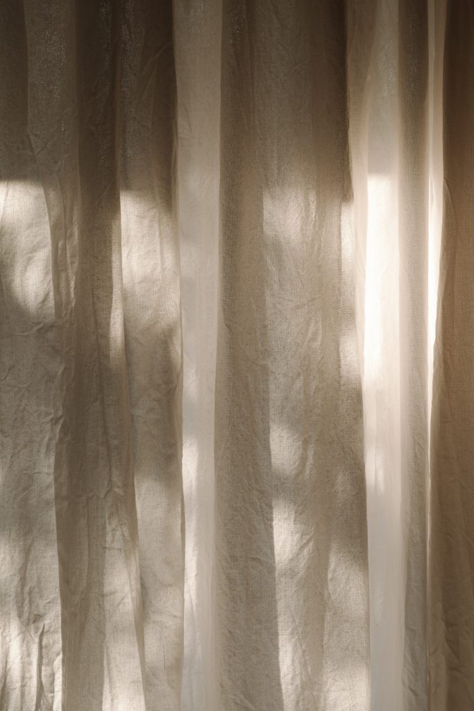 cream curtains with shadows