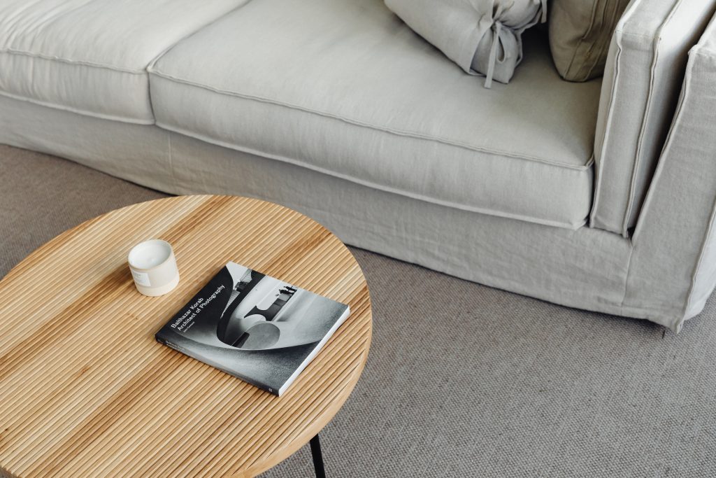 wooden coffee table with linen sofa 