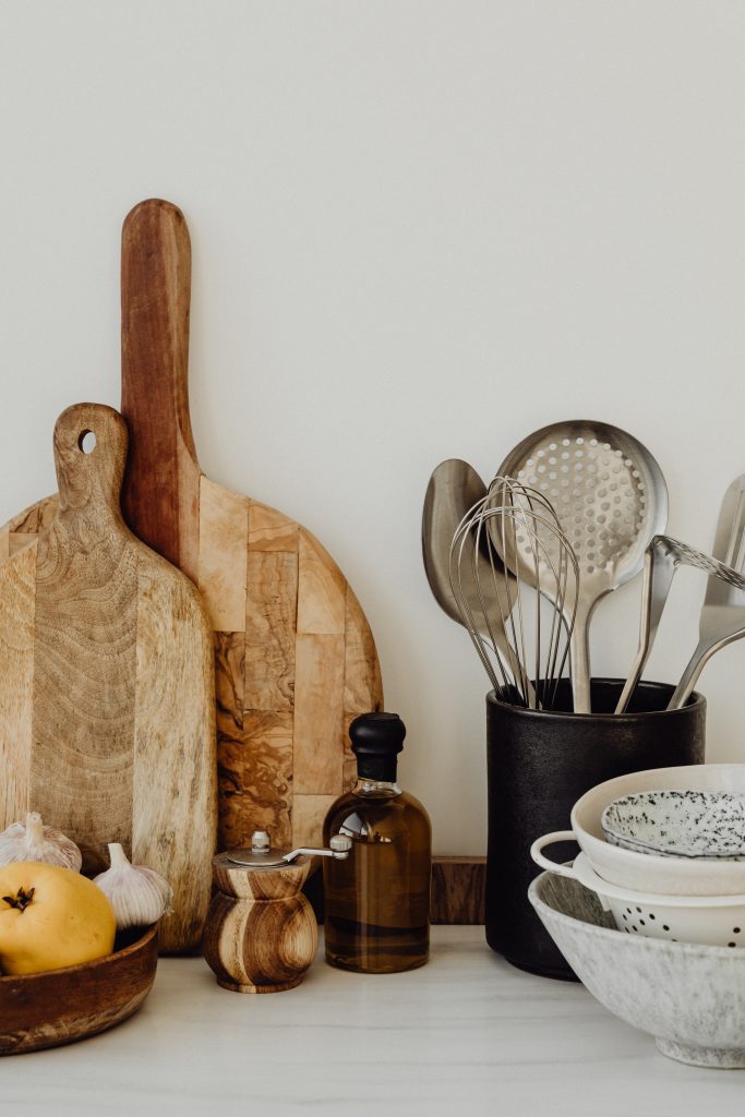 kitchen untensil and wooden chopping board