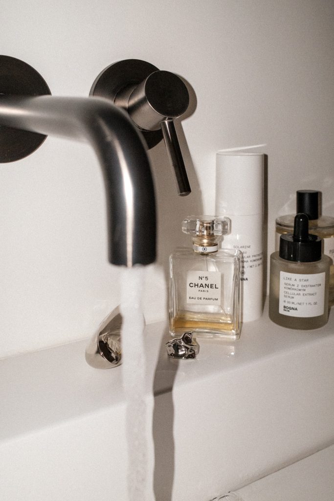 running water beside luxury beauty products