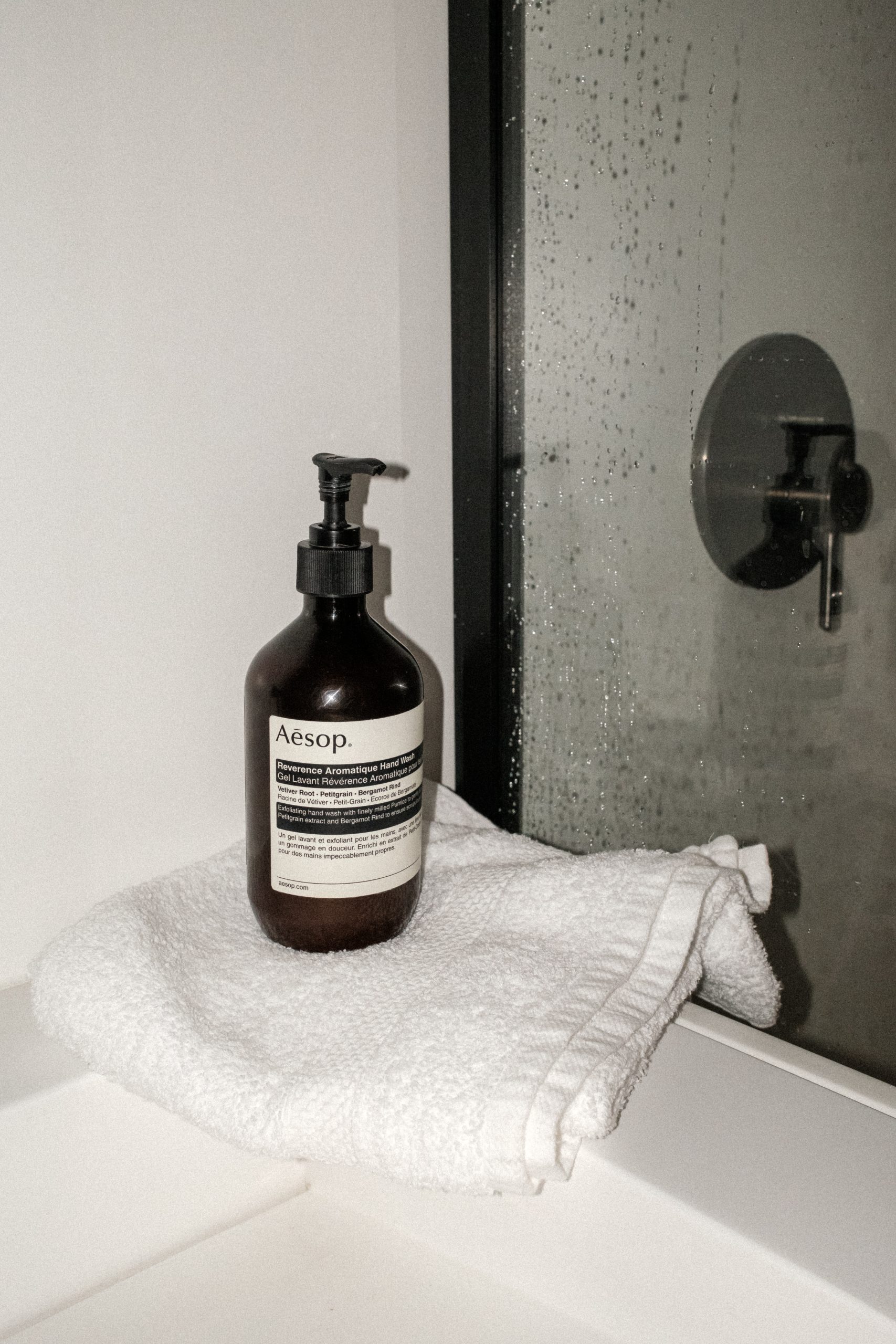 hand soap bottle on white towel