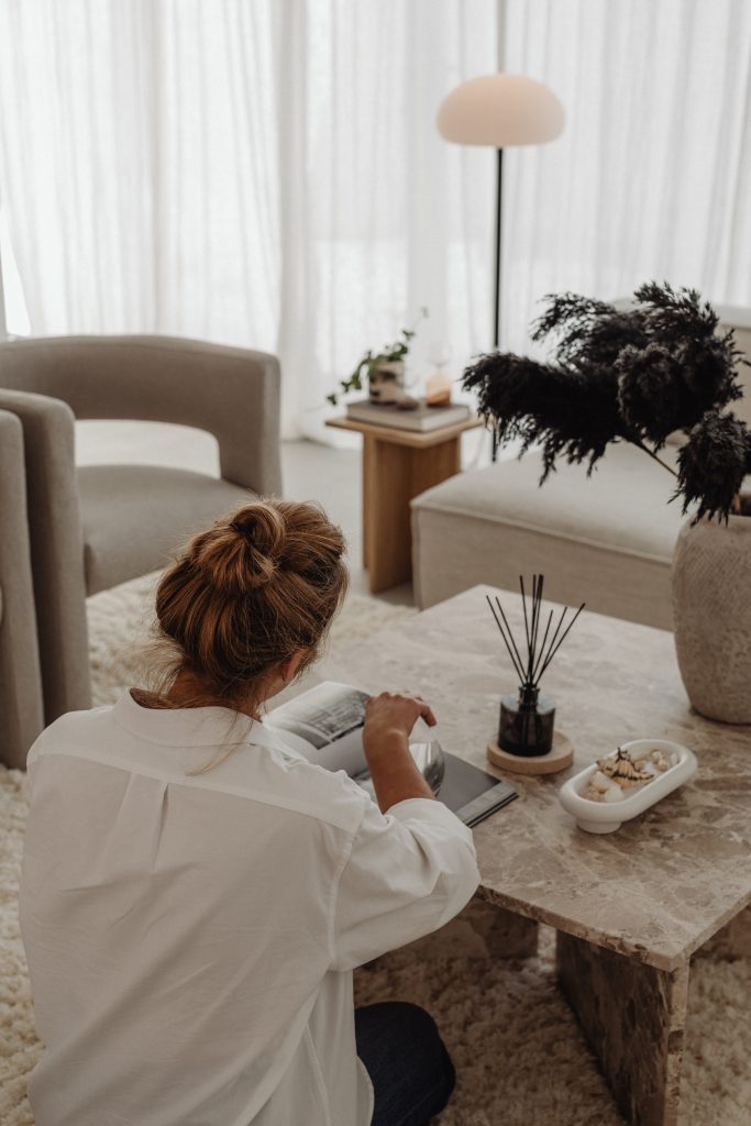 woman reading at marble table