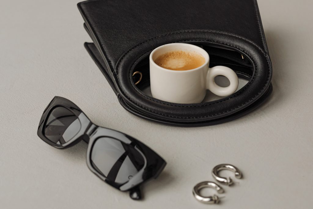 coffee beside black accesories