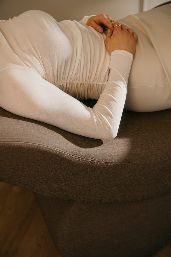 woman holding abdomen