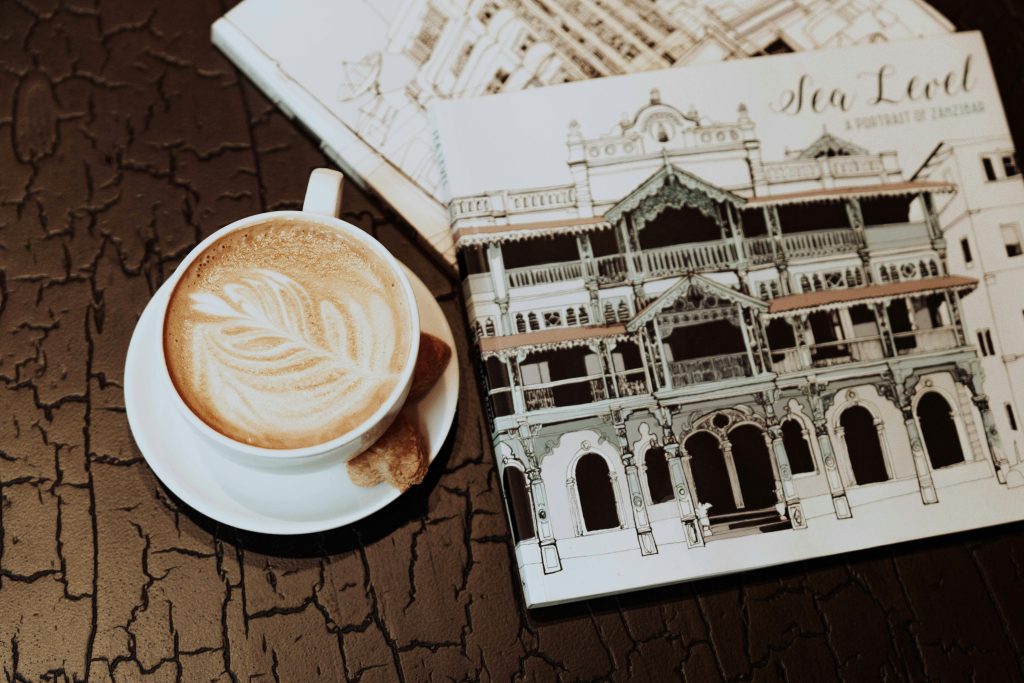 Cofee beside magazine of brown table