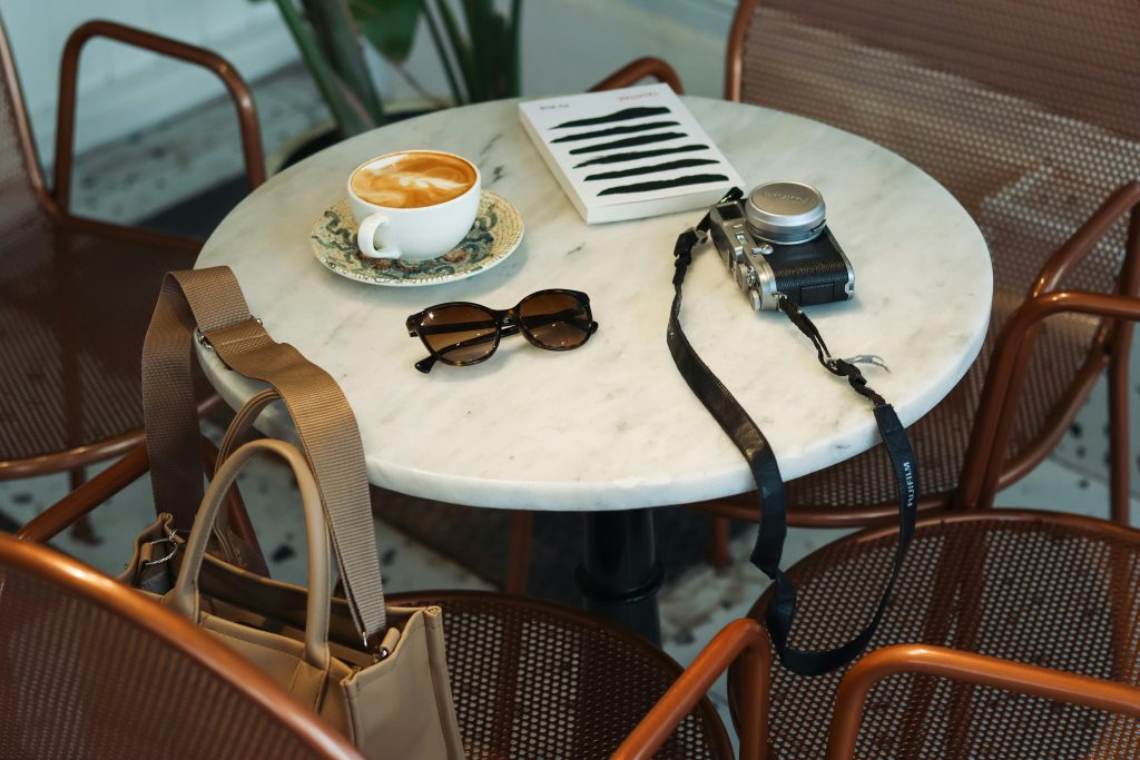 SUNGLASSES ON COFEE TABLE