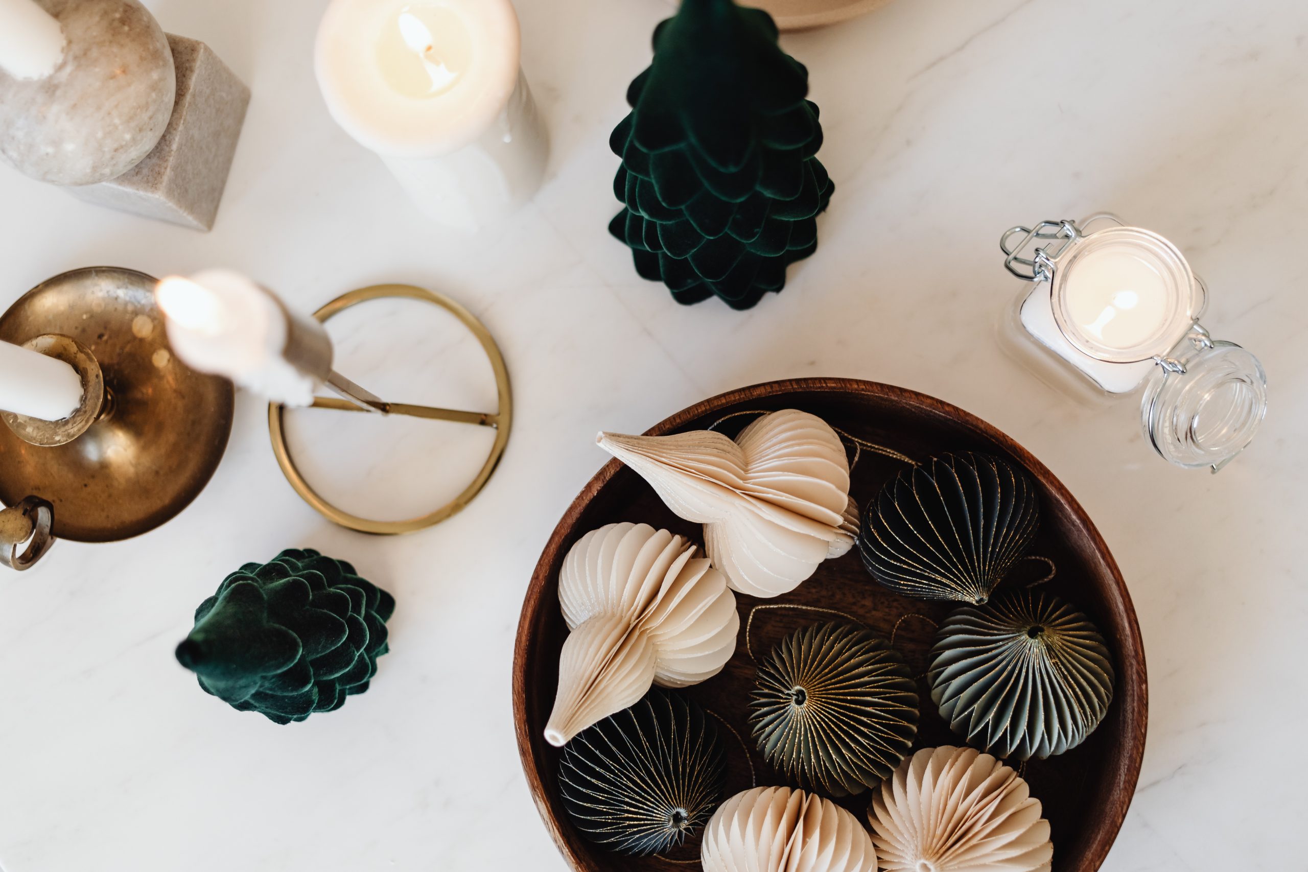 Christams decorations and candle on table