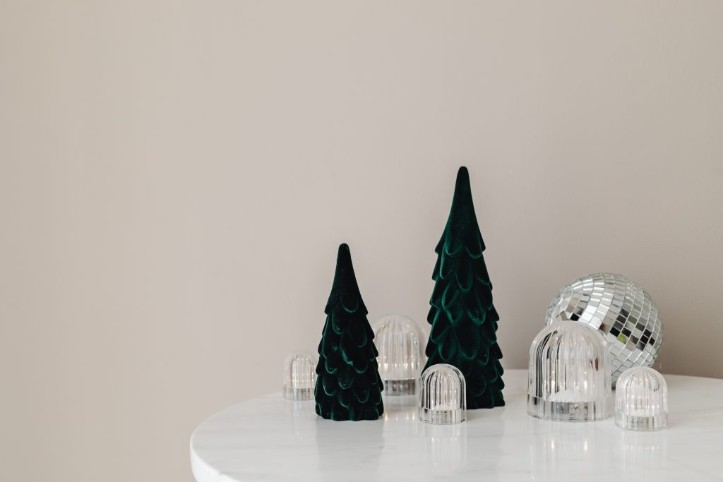 Christams decorations and candle on table
