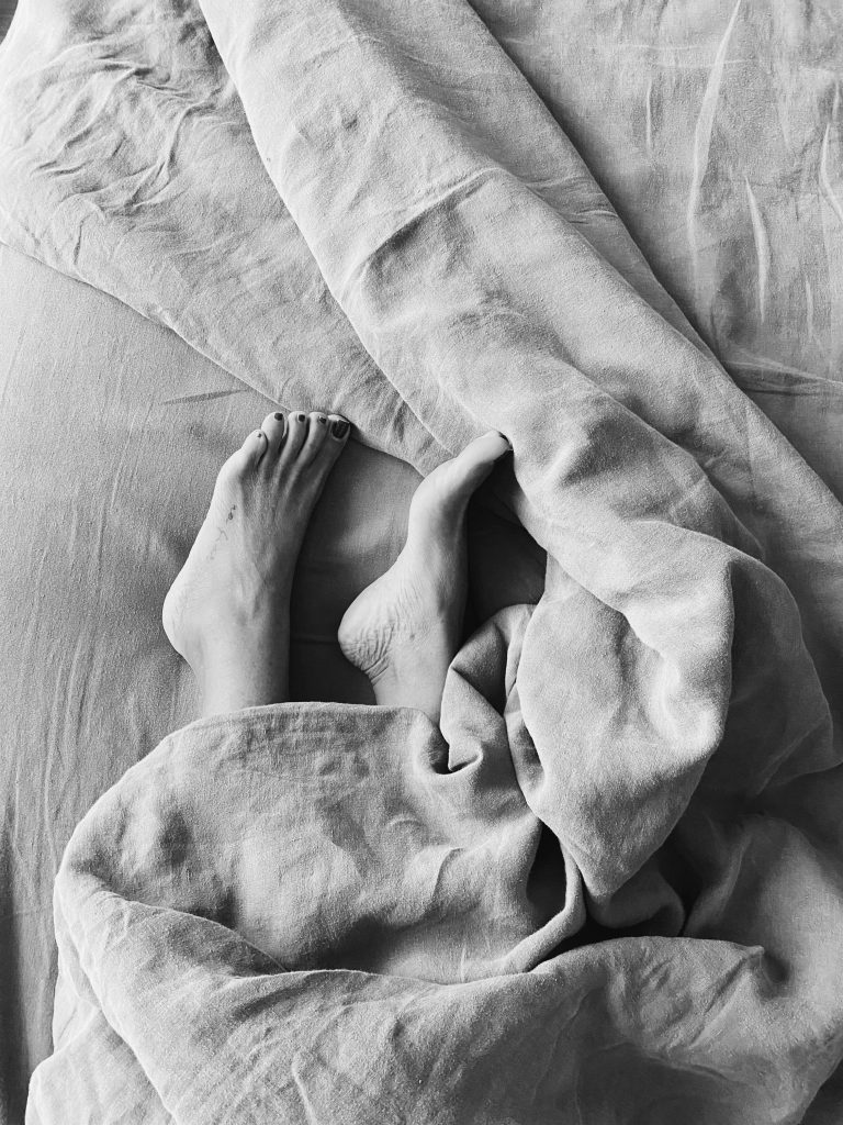 feet out the bottom of a duvet