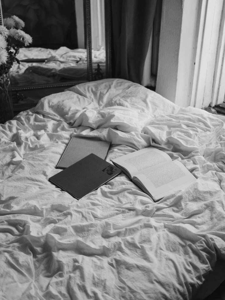 open books on a bed