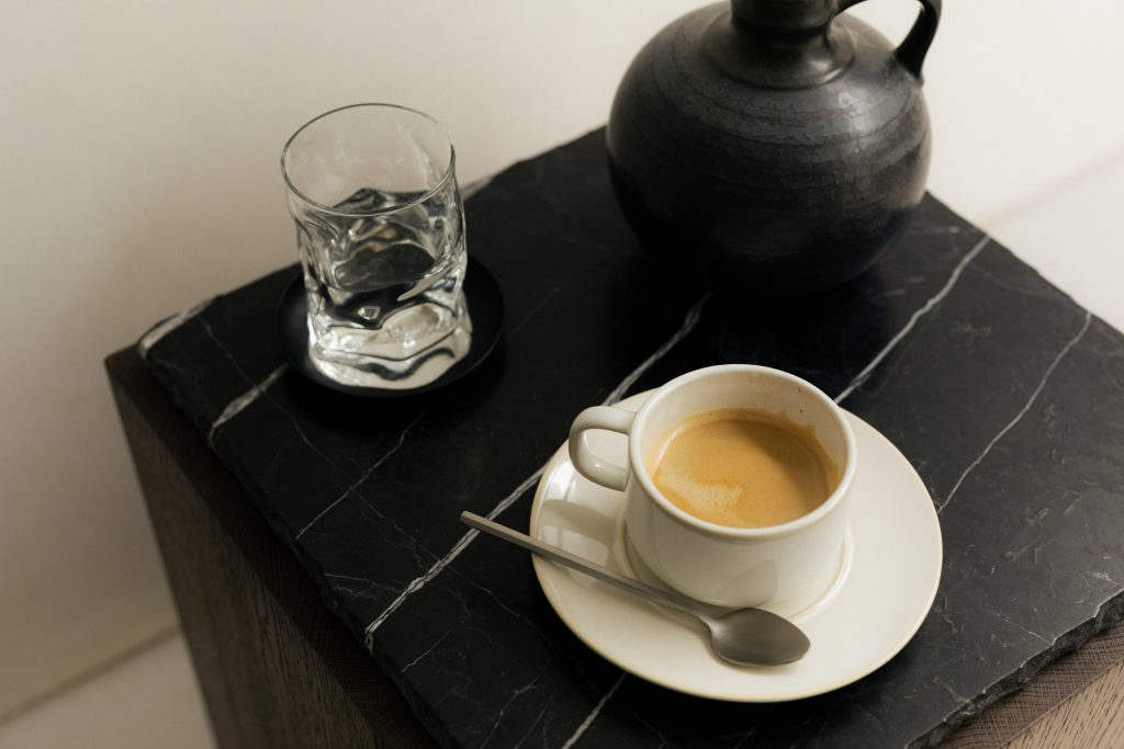 black tea pot on black marble table