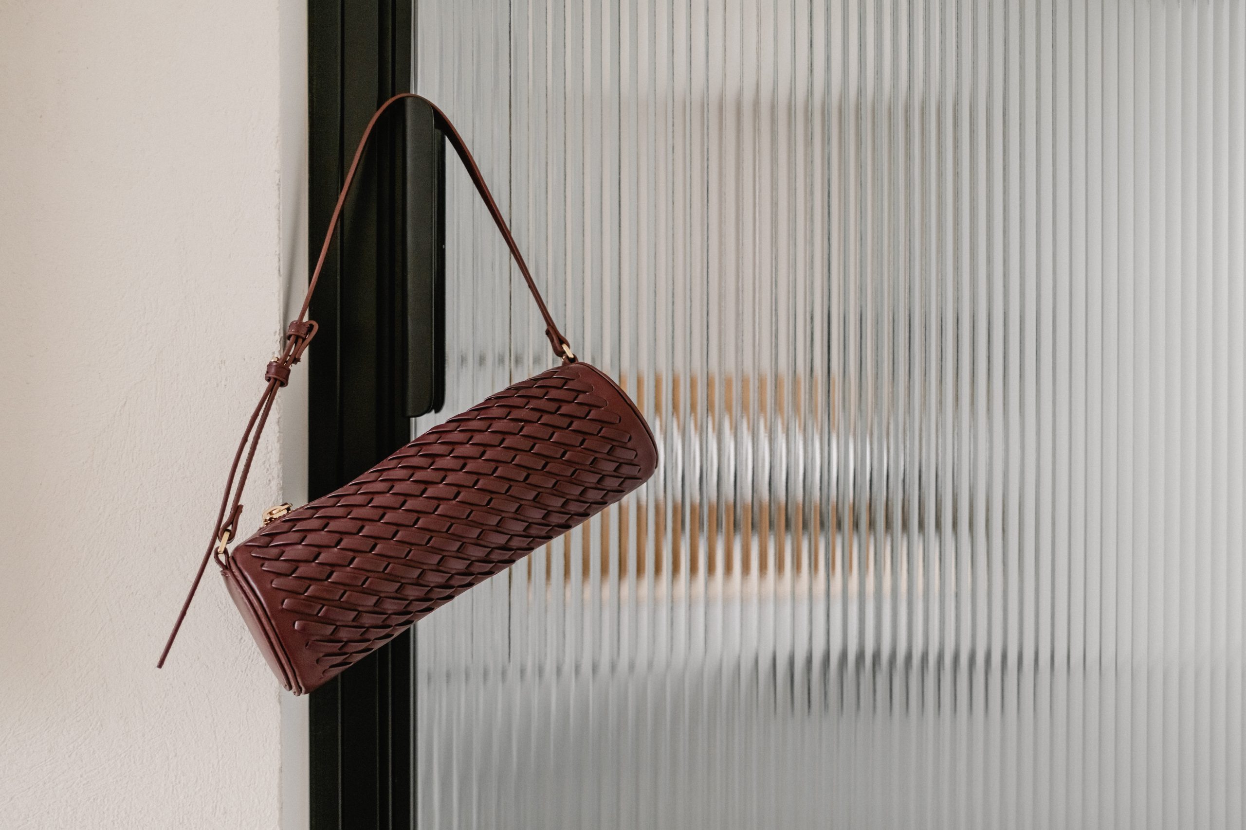 red bag hanging on black door frame