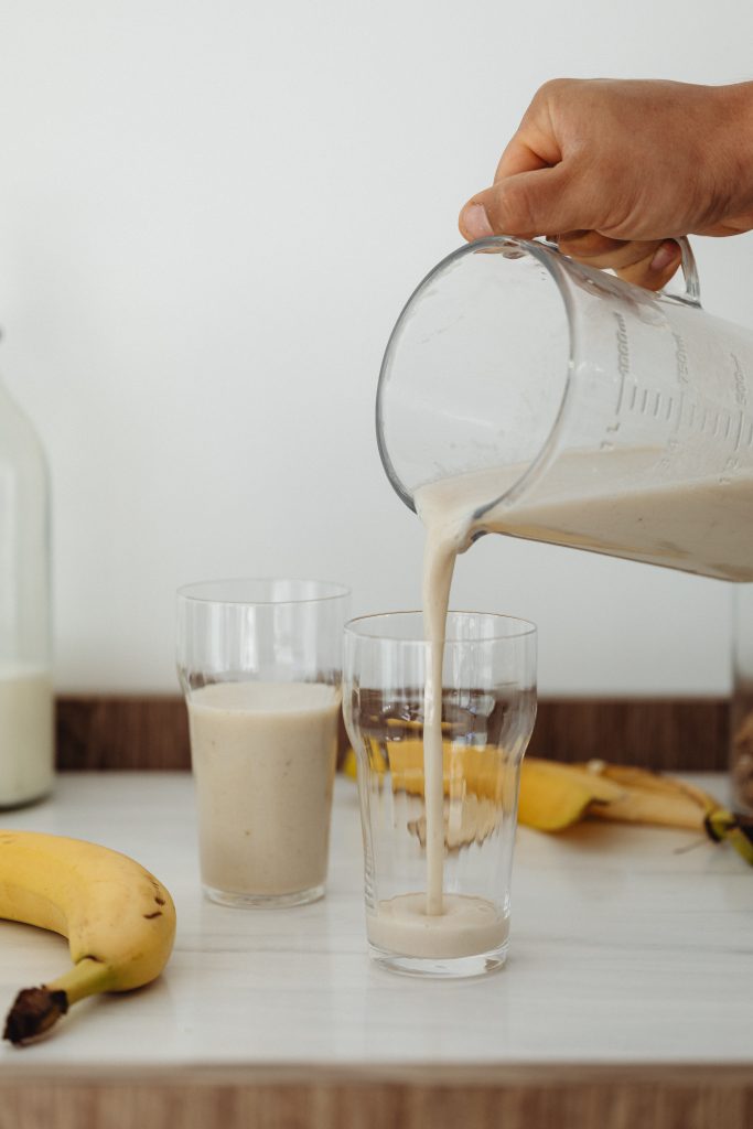 pouring smoothoes into a glass