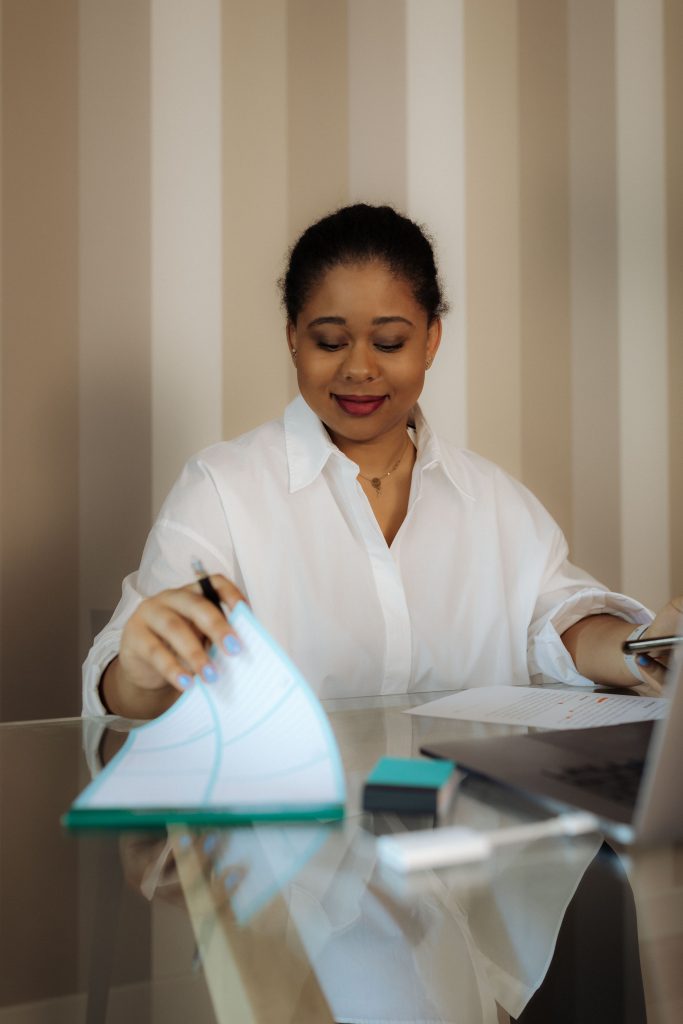 woman looking at notepad