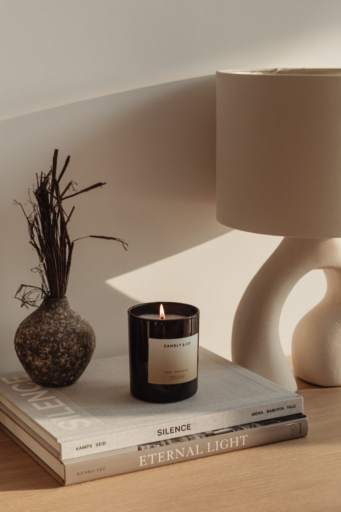 aroma diffuser with candle, lamp, and, books