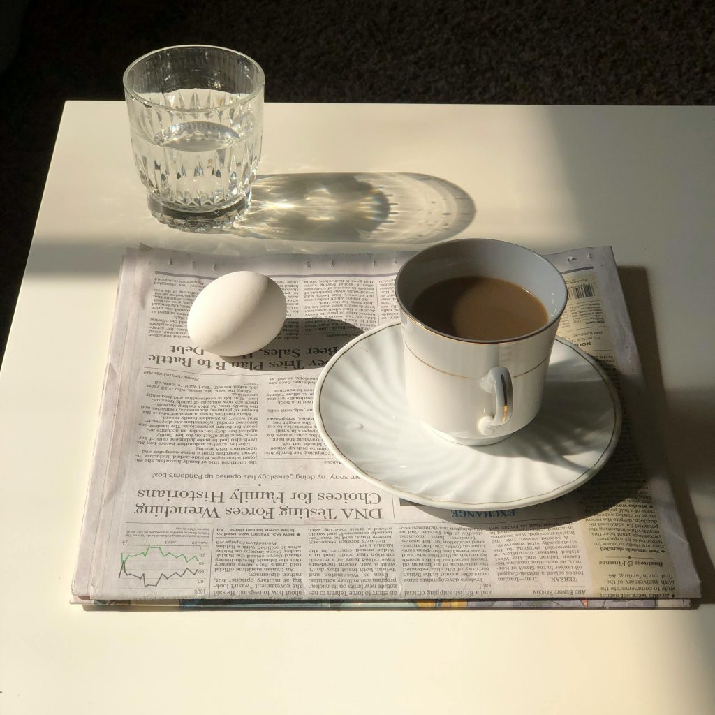 cup-of-coffee-on-top-of-newspaper