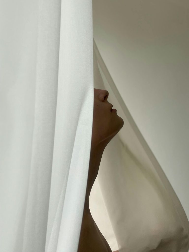 woman-behind-curtain